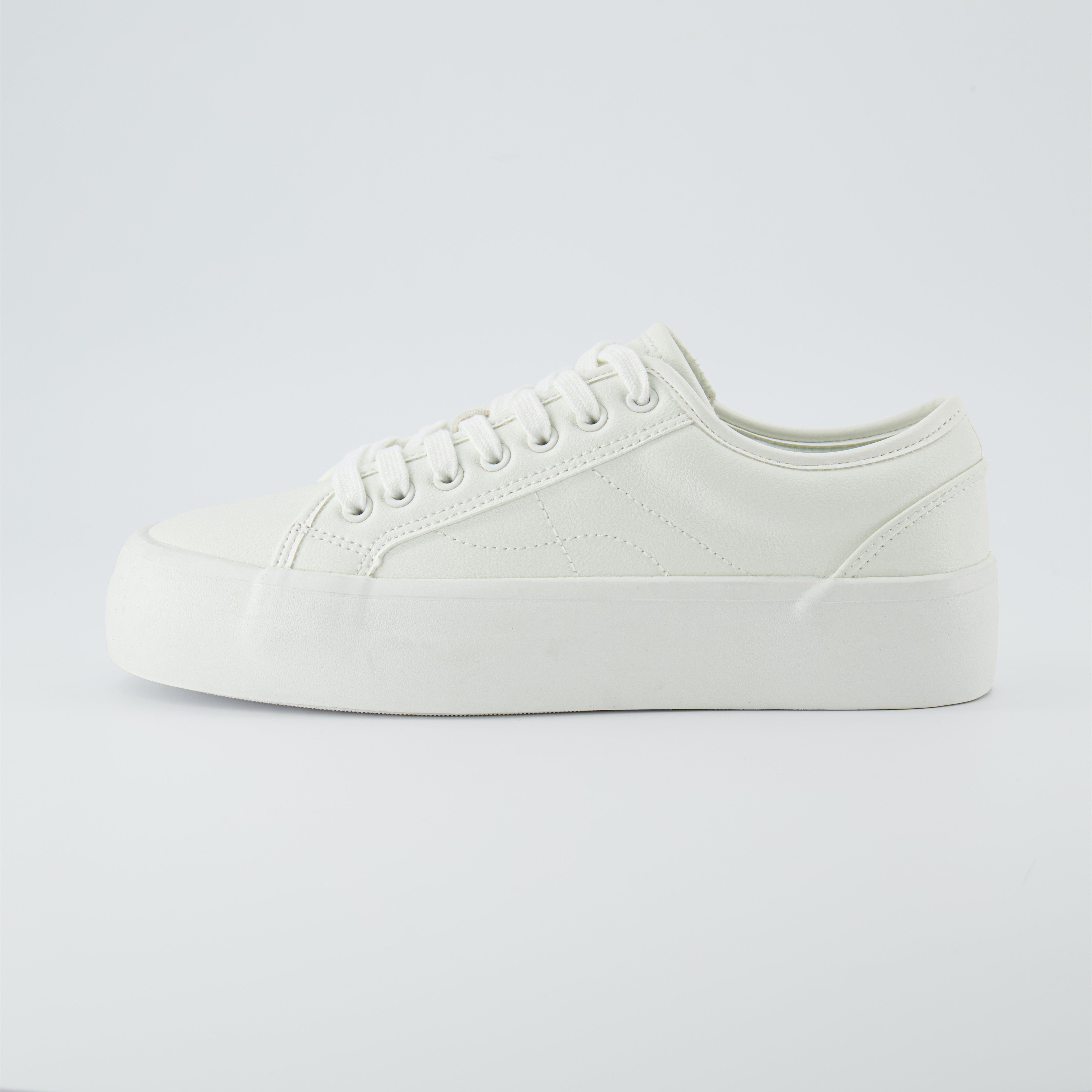 Tag Low Top Canvas Sneaker White Vegan Leather